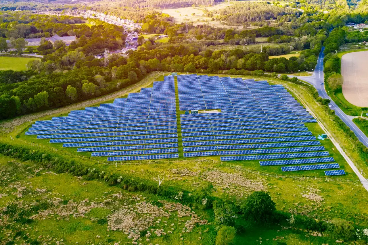 Aerial view of community solar installation in a rural landscape